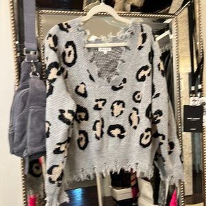 Grey, black and crème animal print sweater. Miracle USA